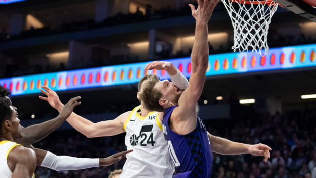 December 16, 2023; Sacramento, California, USA; Utah Jazz center Walker Kessler (24) fouls Sacramento Kings forward Domantas Sabonis (10) during the third quarter at Golden 1 Center. 